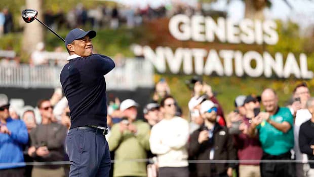 Tiger Woods watches a drive in the first round of the 2023 Genesis Invitational.
